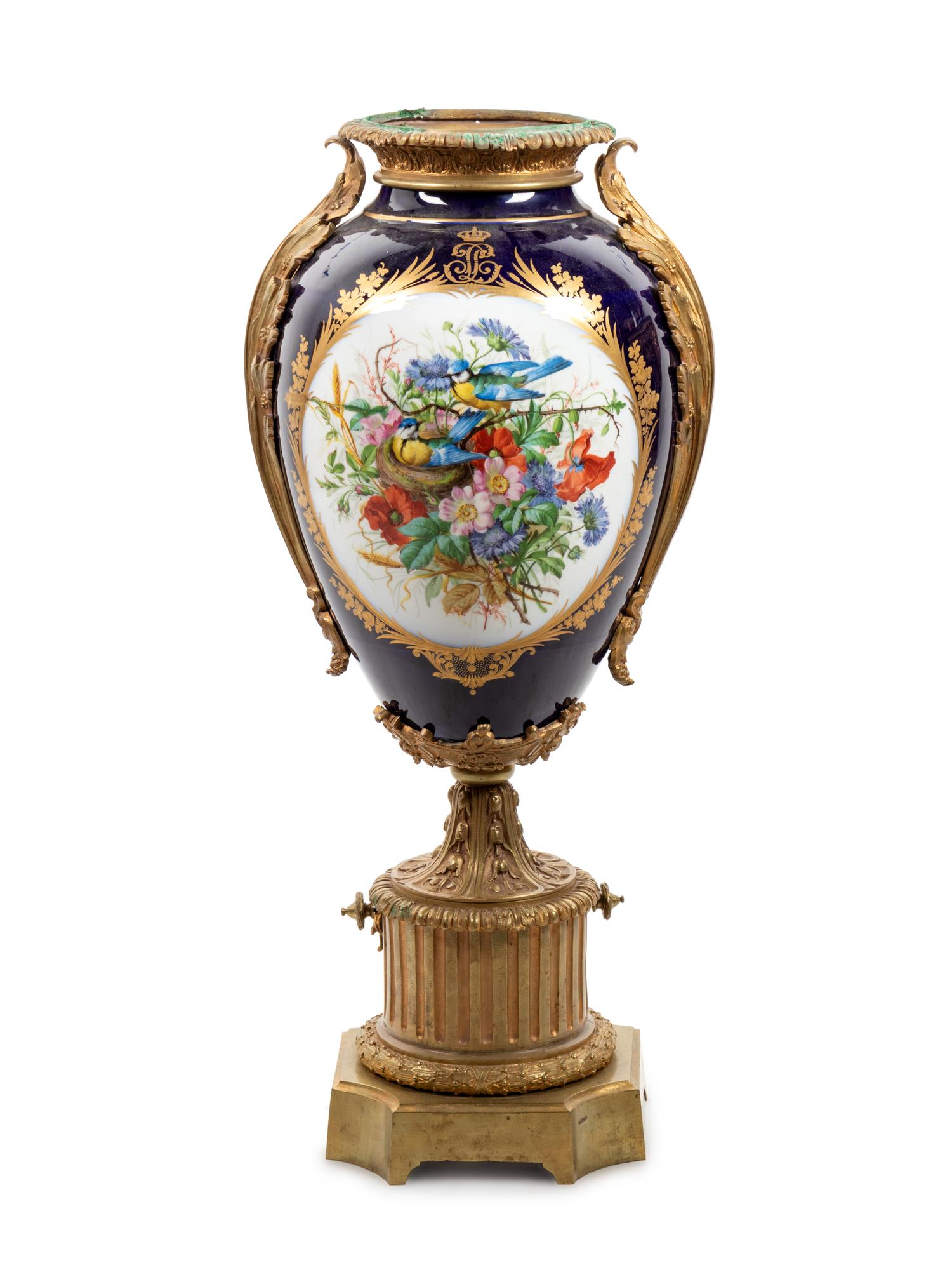 A Sèvres Style Gilt Bronze Mounted Painted and Parcel Gilt Porcelain Urn