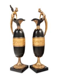 A Pair of Continental Gilt and Patinated Bronze Ewers