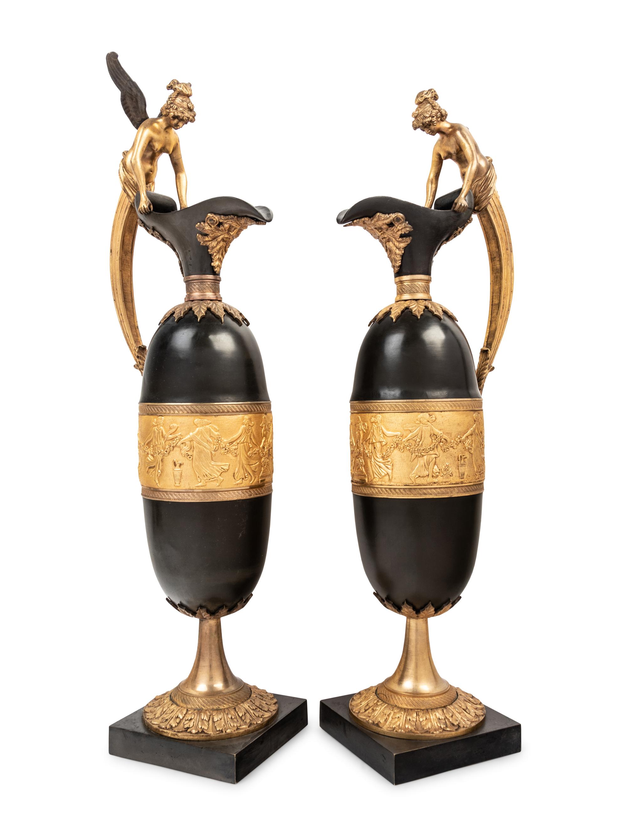 A Pair of Continental Gilt and Patinated Bronze Ewers