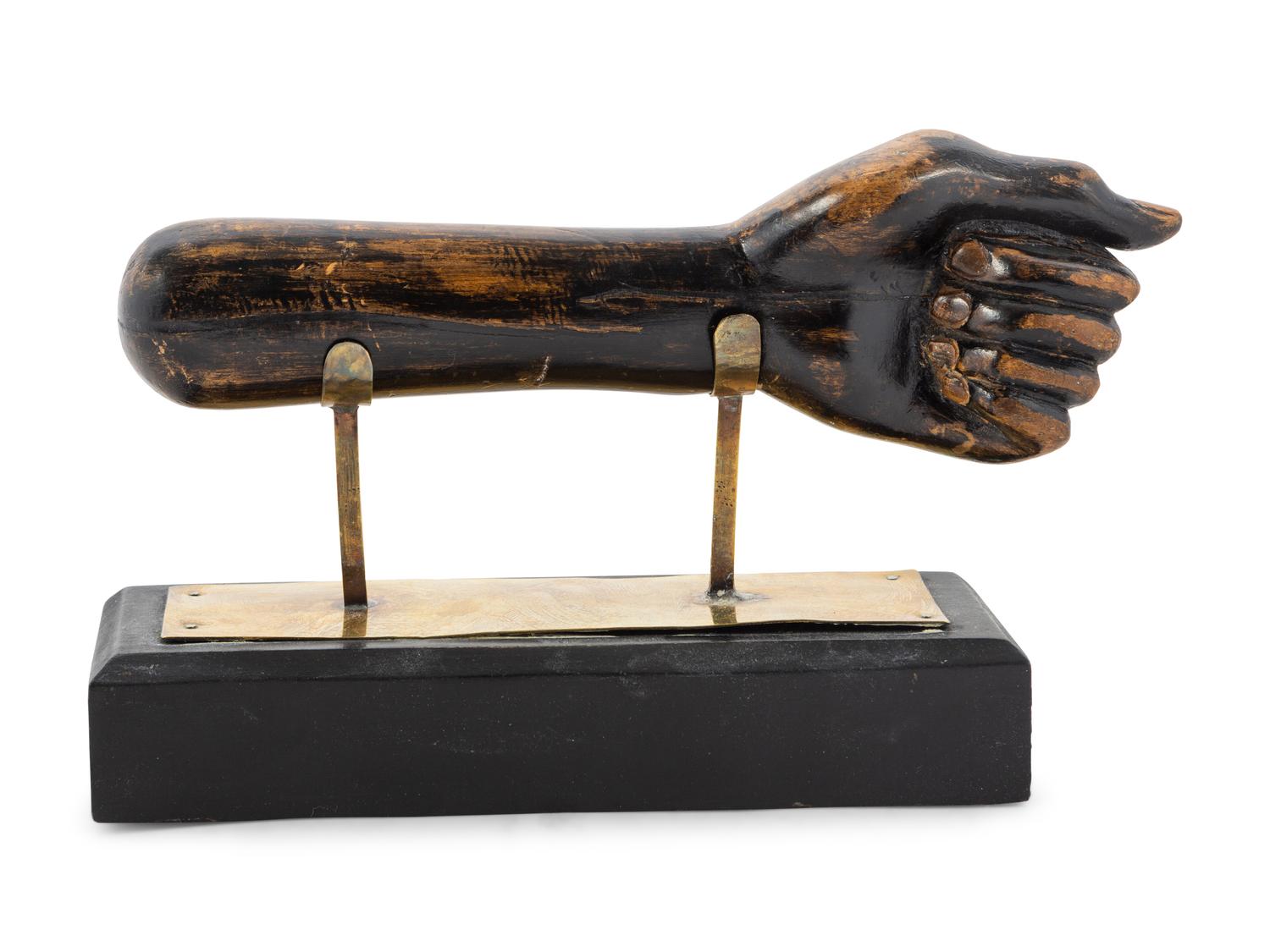 A Carved and Painted Clinched Fist