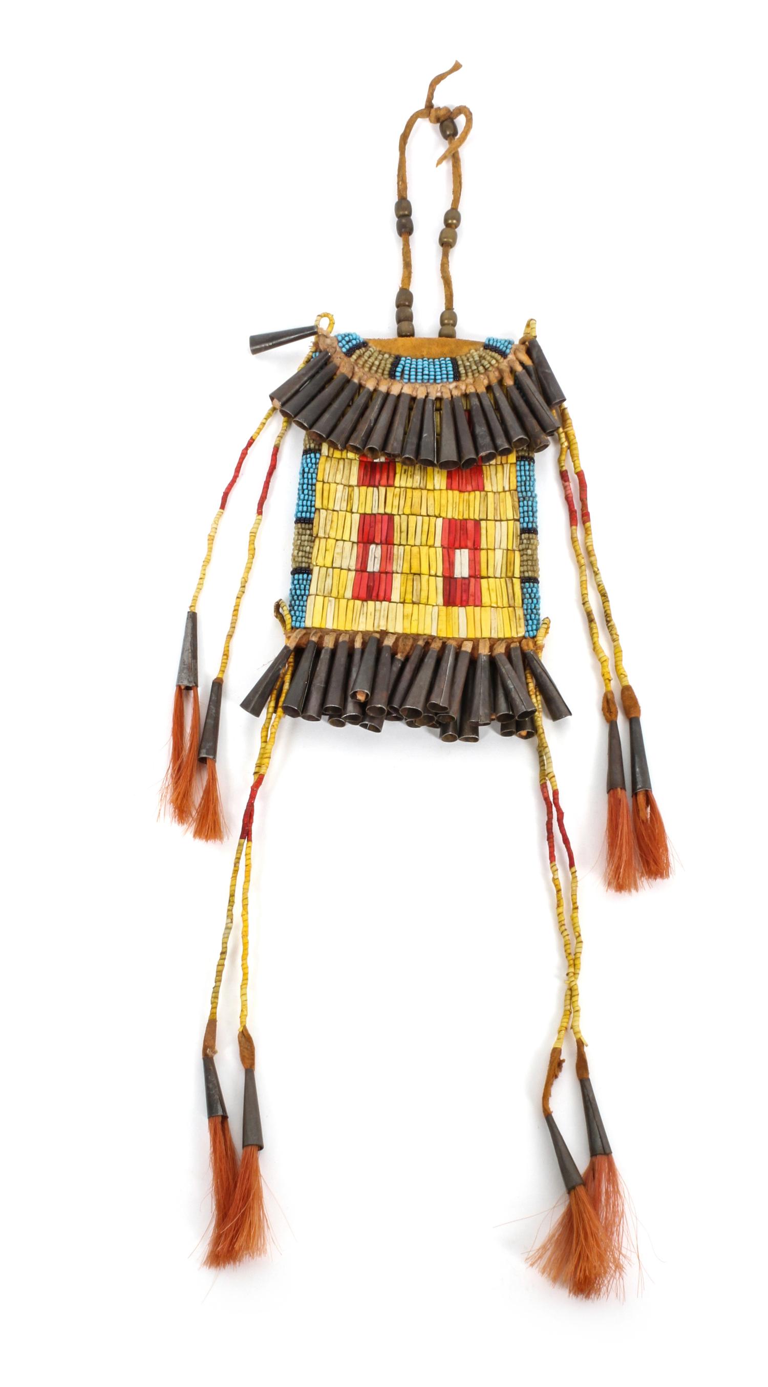 A Plains Style Strike-a-Light Length overall 17 inches. — LATE 20TH CENTURY