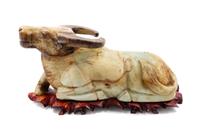 A Large Chinese Carved Hardstone Model of a Bull and Stand