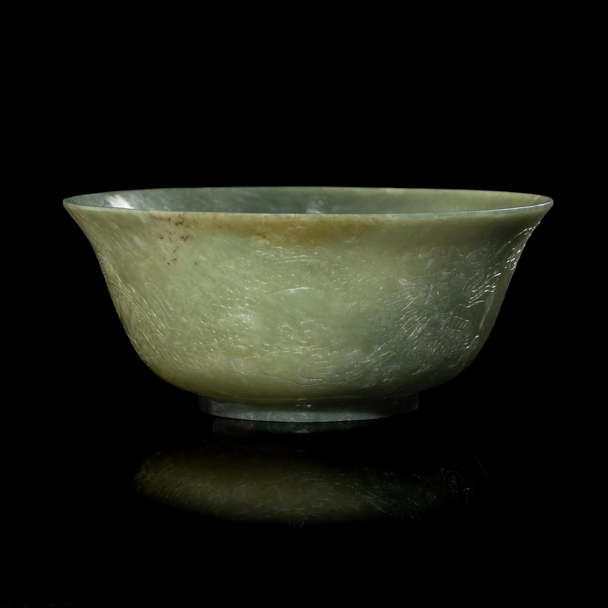 A Chinese Celadon Jade 'Dragon' Bowl, 20th Century 近代 青玉刻龍紋碗
