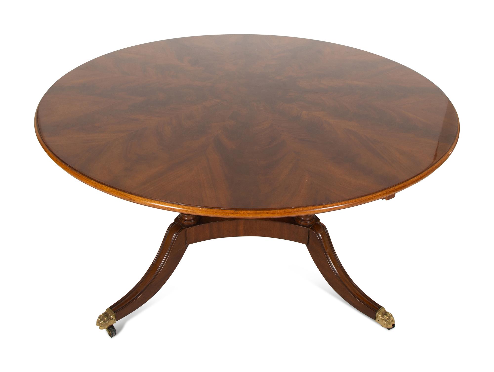 A Pair of Regency Style Mahogany Circular Dinner Tables