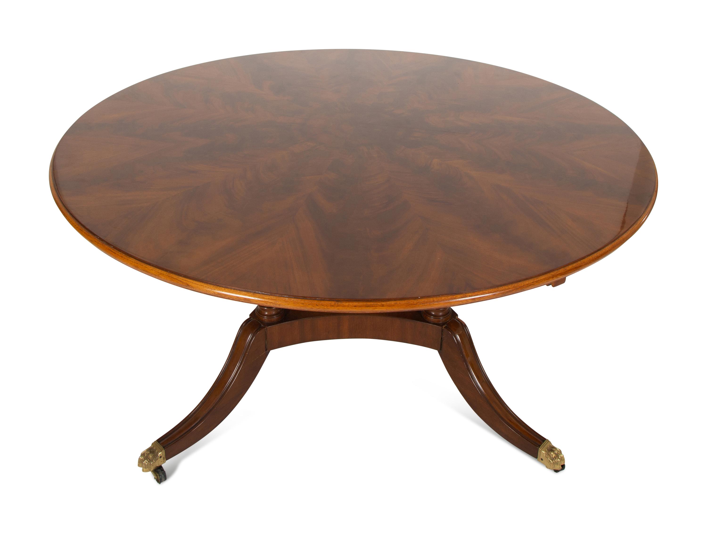 A Pair of Regency Style Mahogany Circular Dinner Tables