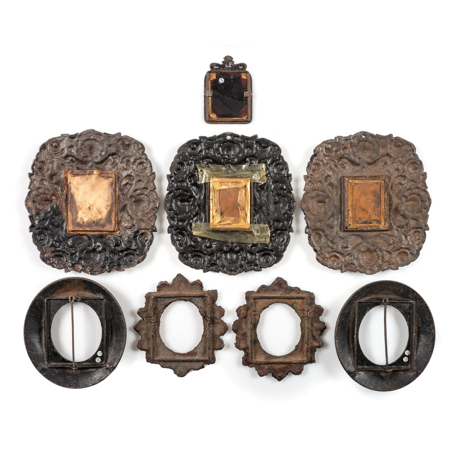 [EARLY PHOTOGRAPHY - CASES AND FRAMES]. A group of 8 cast iron wall frames, including:
