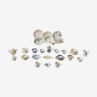 An assorted group of twenty-eight English soft paste porcelain and salt-glazed stoneware tablewares Various makers, 18th century