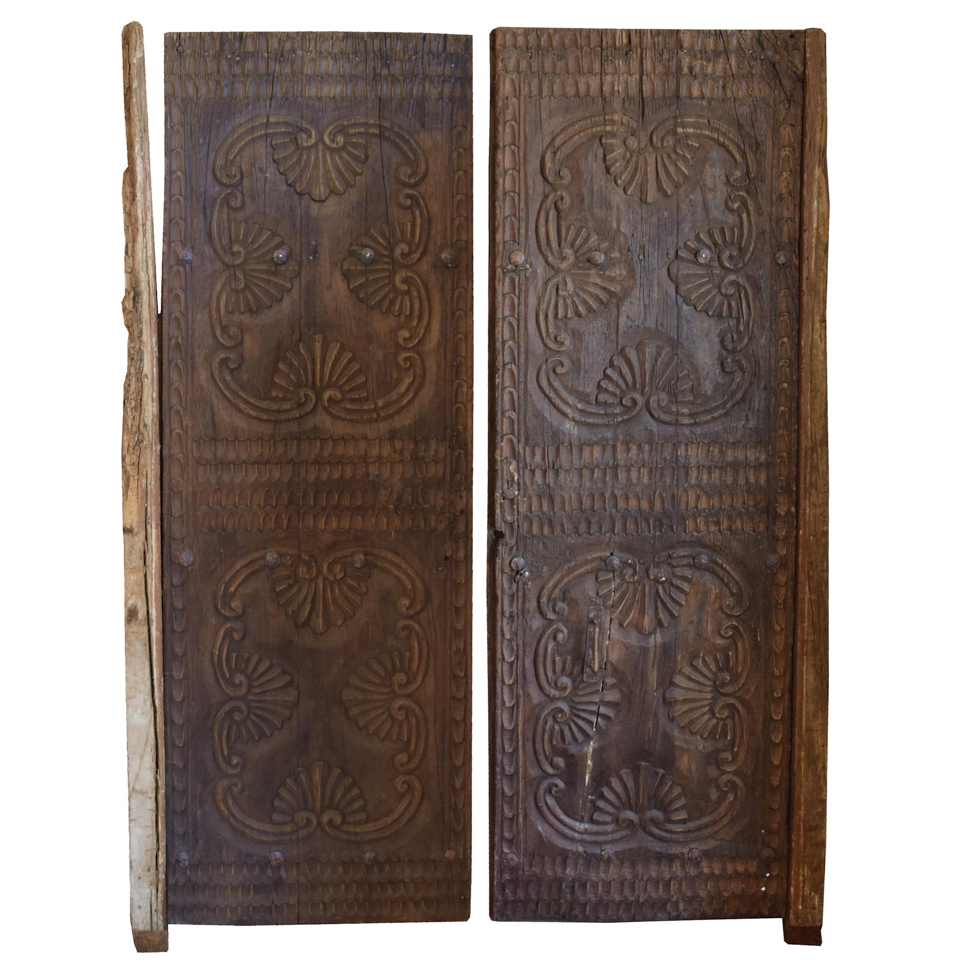 A Pair of Carved Wood Doors 27" W x 3" D x 78" H and 29" W x 4" D x 79" H — Peru, 19th/20th Century