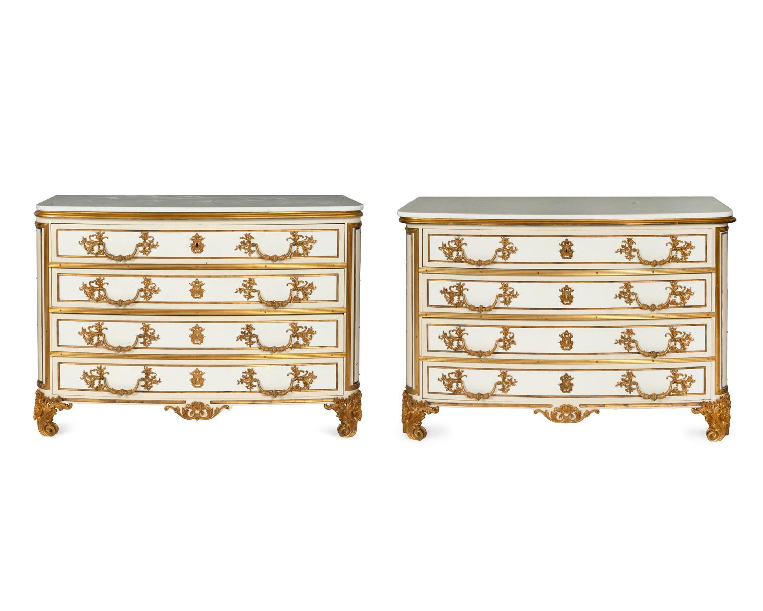 A Pair of Louis XIV Style Cream-Painted and Gilt Bronze Mounted Marble-Top Commodes