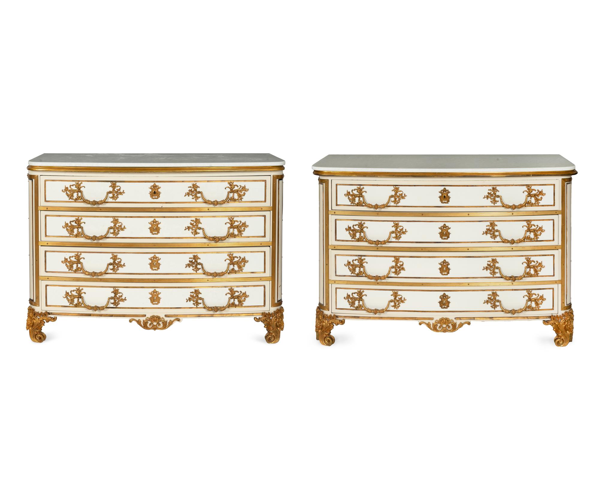 A Pair of Louis XIV Style Cream-Painted and Gilt Bronze Mounted Marble-Top Commodes