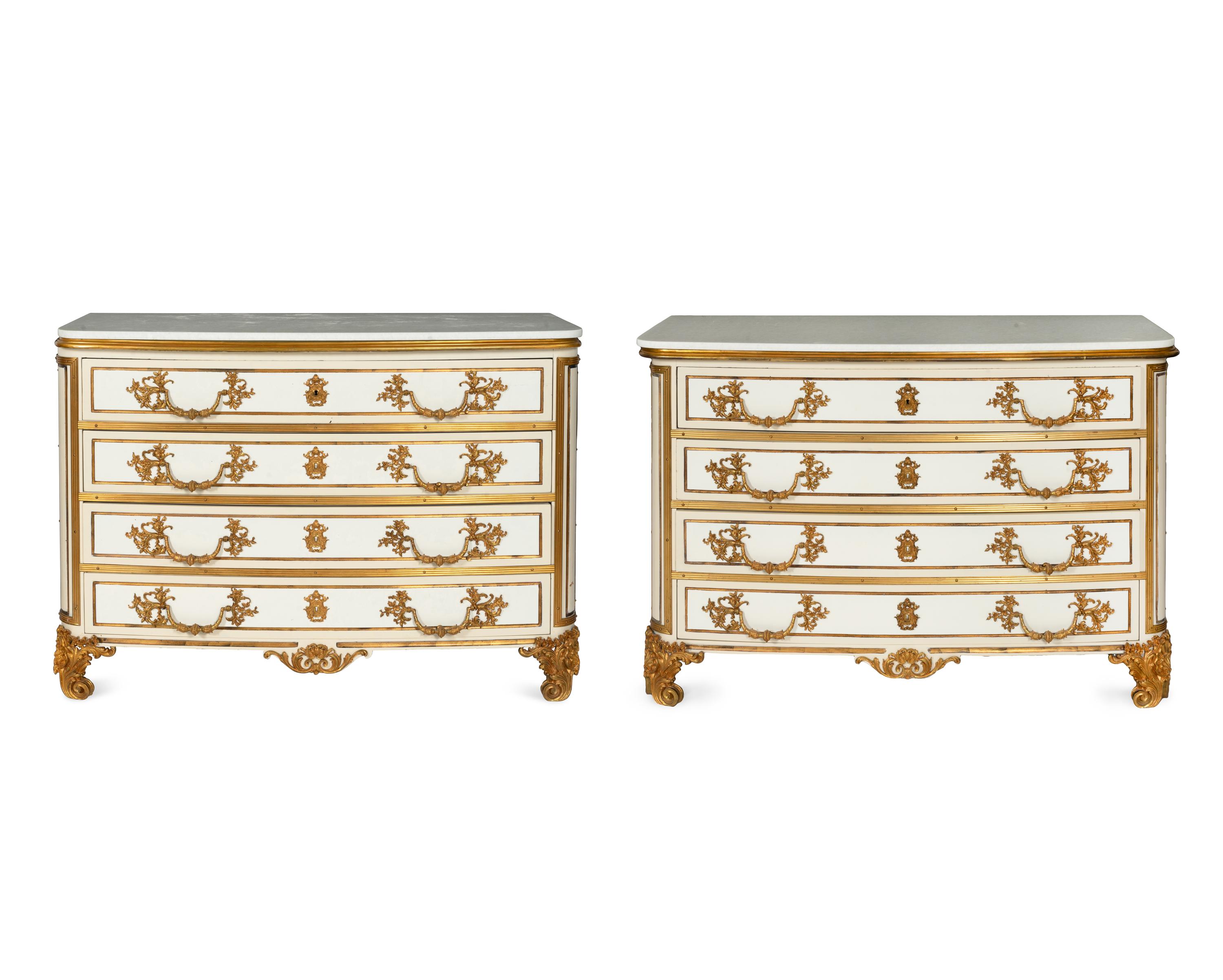 A Pair of Louis XIV Style Cream-Painted and Gilt Bronze Mounted Marble-Top Commodes