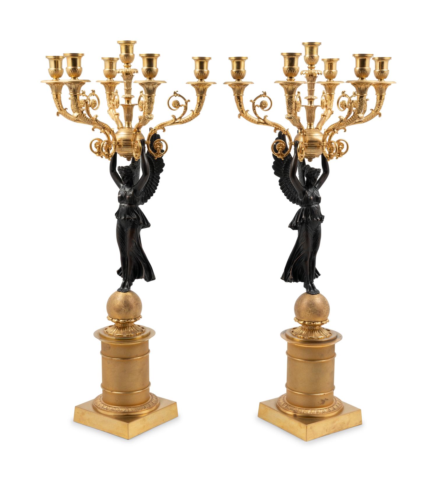 A Pair of Empire Style Gilt and Patinated Metal Six-Light Figural Candelabra