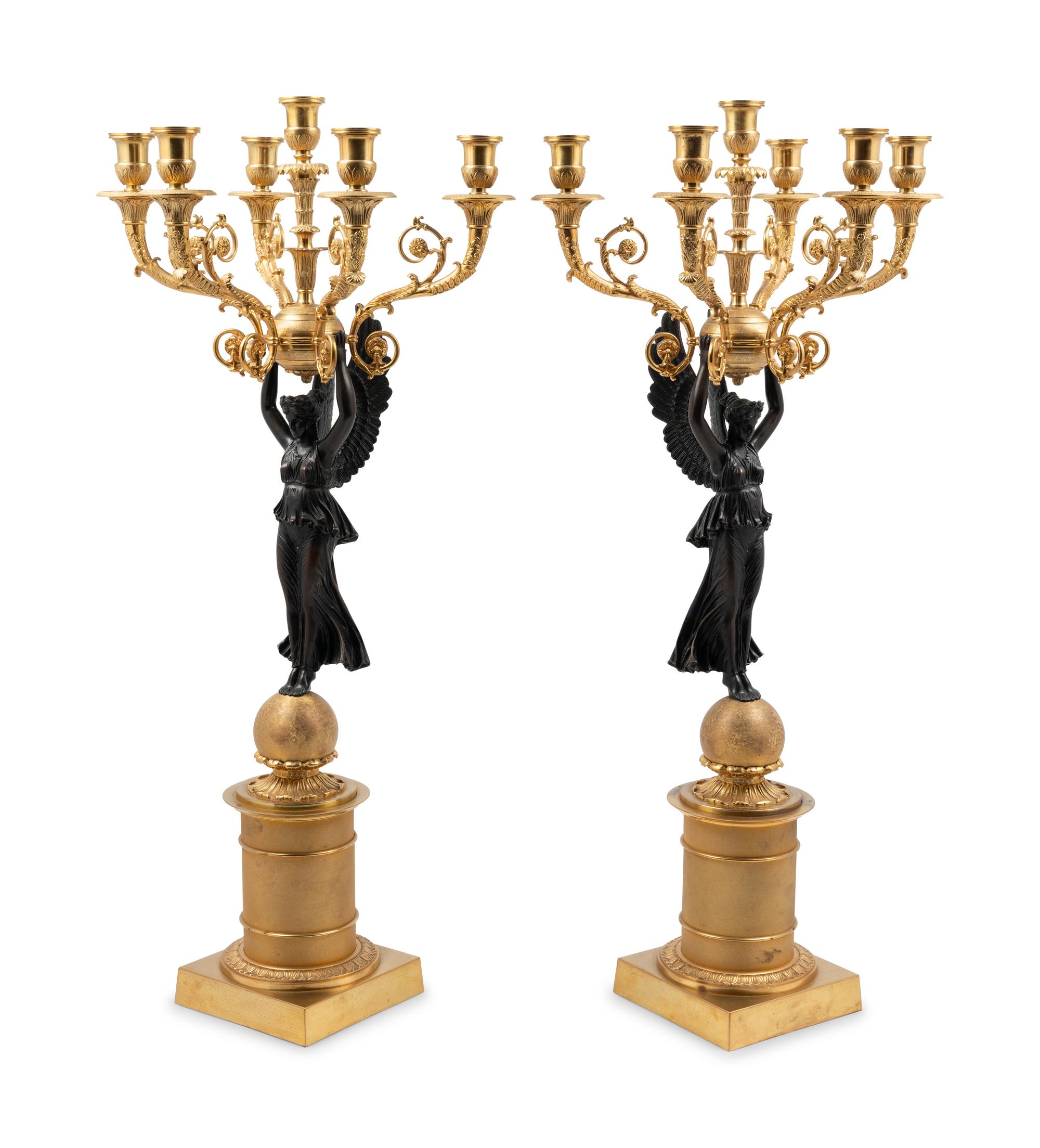 A Pair of Empire Style Gilt and Patinated Metal Six-Light Figural Candelabra
