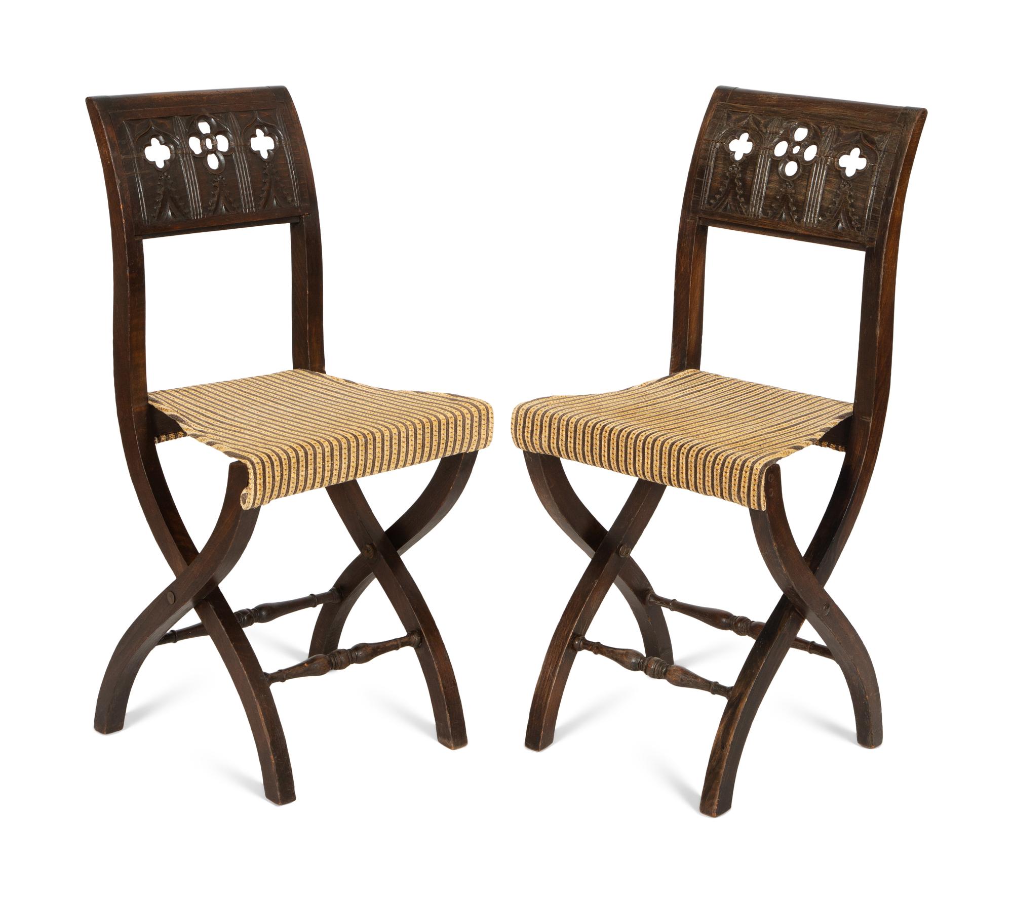A Pair of Continental Carved Oak 'Gothic' Folding Chairs