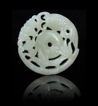 A Pierce Carved Jade Circular Pendant Diameter 2 inches.