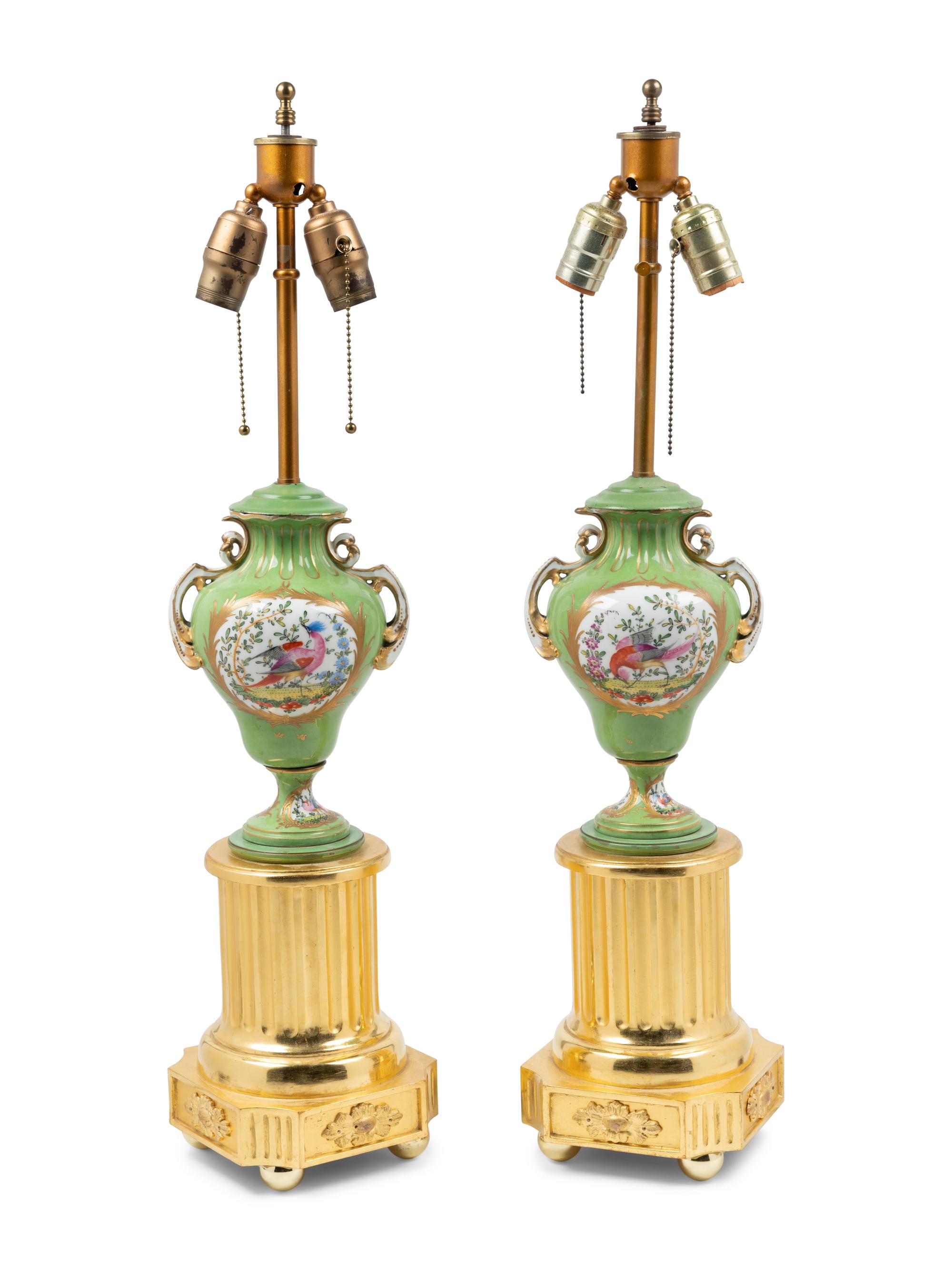 A Pair of Sèvres Style Porcelain and Giltwood Urns Mounted as Lamps