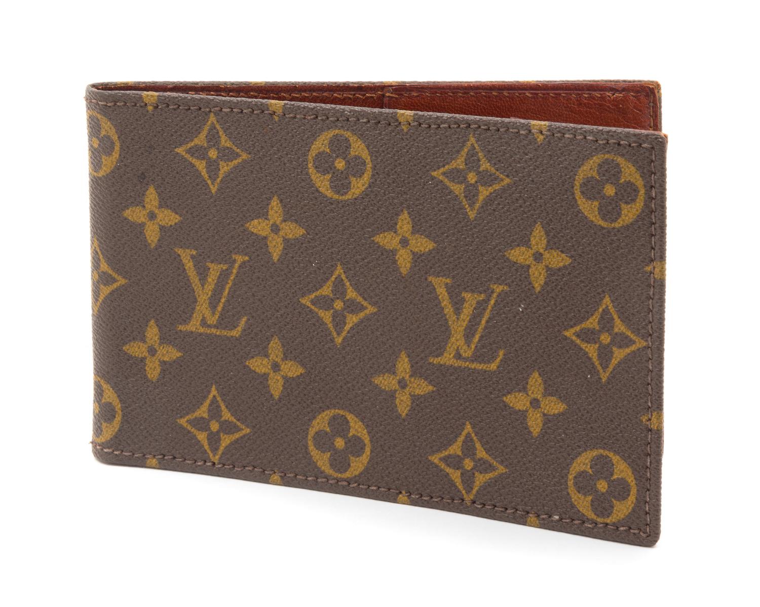 A Louis Vuitton Monogram Canvas Passport Holder, 7" x 4.5".