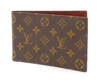 A Louis Vuitton Monogram Canvas Passport Holder, 7" x 4.5".