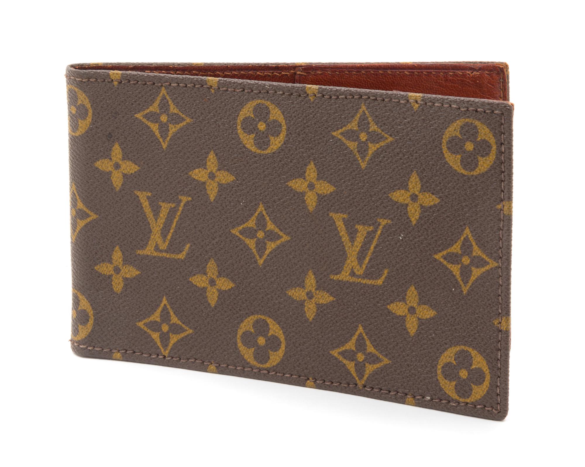 A Louis Vuitton Monogram Canvas Passport Holder, 7" x 4.5".