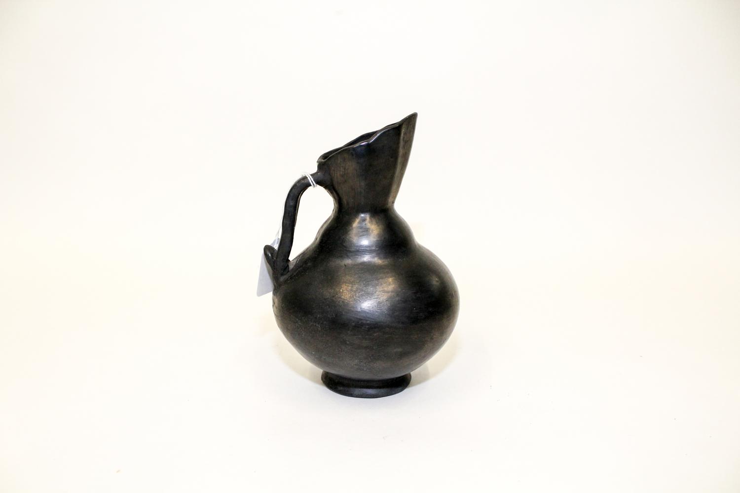A Blackware Pottery Ewer, Dona Rosa, Oaxaca, Mexico Height 7 1/2 inches.