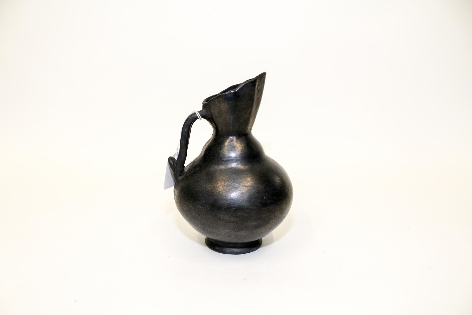 A Blackware Pottery Ewer, Dona Rosa, Oaxaca, Mexico Height 7 1/2 inches.