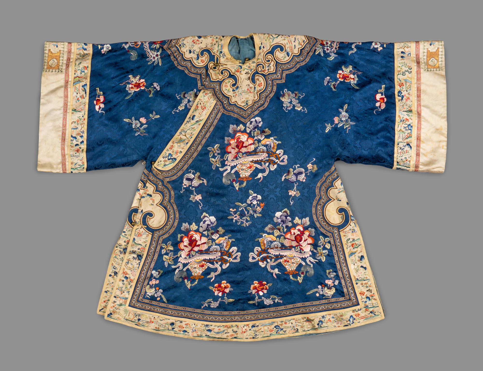 A Chinese Blue Ground Embroidered Silk Lady's Coat, Ao