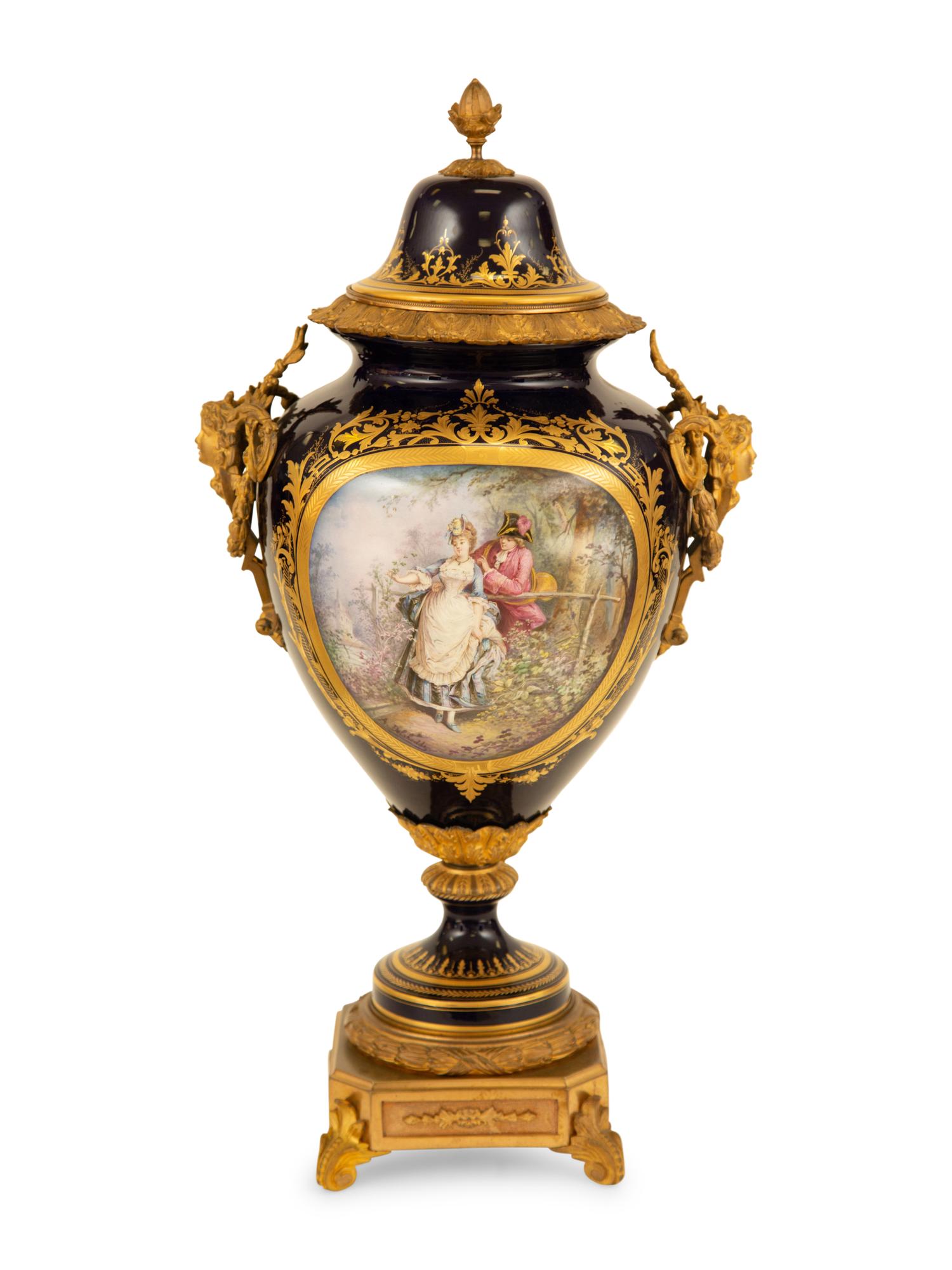 A Sèvres Style Gilt Metal Mounted Porcelain Urn and Cover