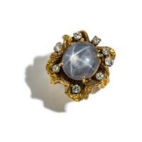 YELLOW GOLD, STAR SAPPHIRE, AND DIAMOND RING