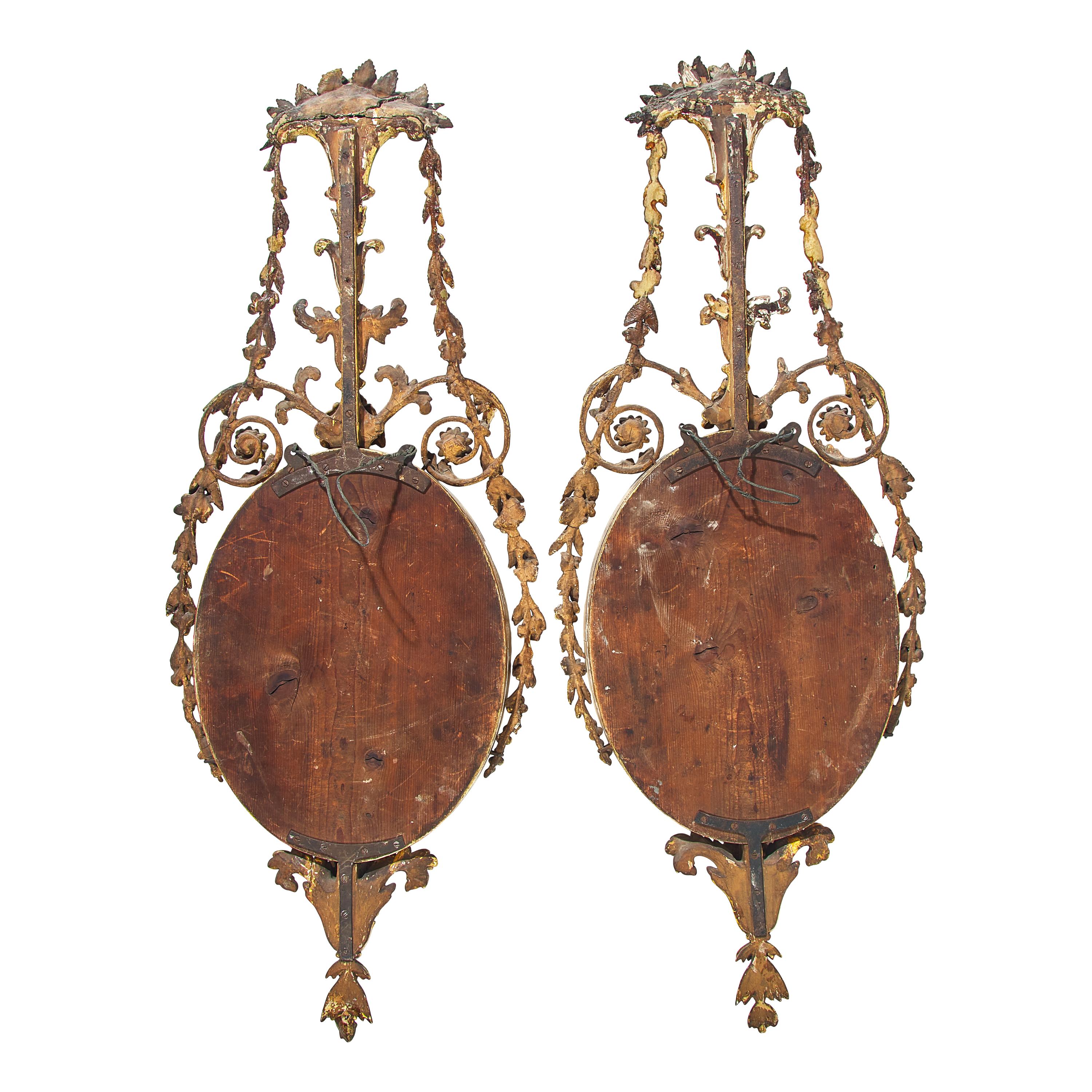 A Pair of Neoclassical Cobalt Glass-Inset and Giltwood Mirrors