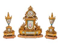 A French Gilt Bronze and Sevres Style Porcelain Clock Garniture