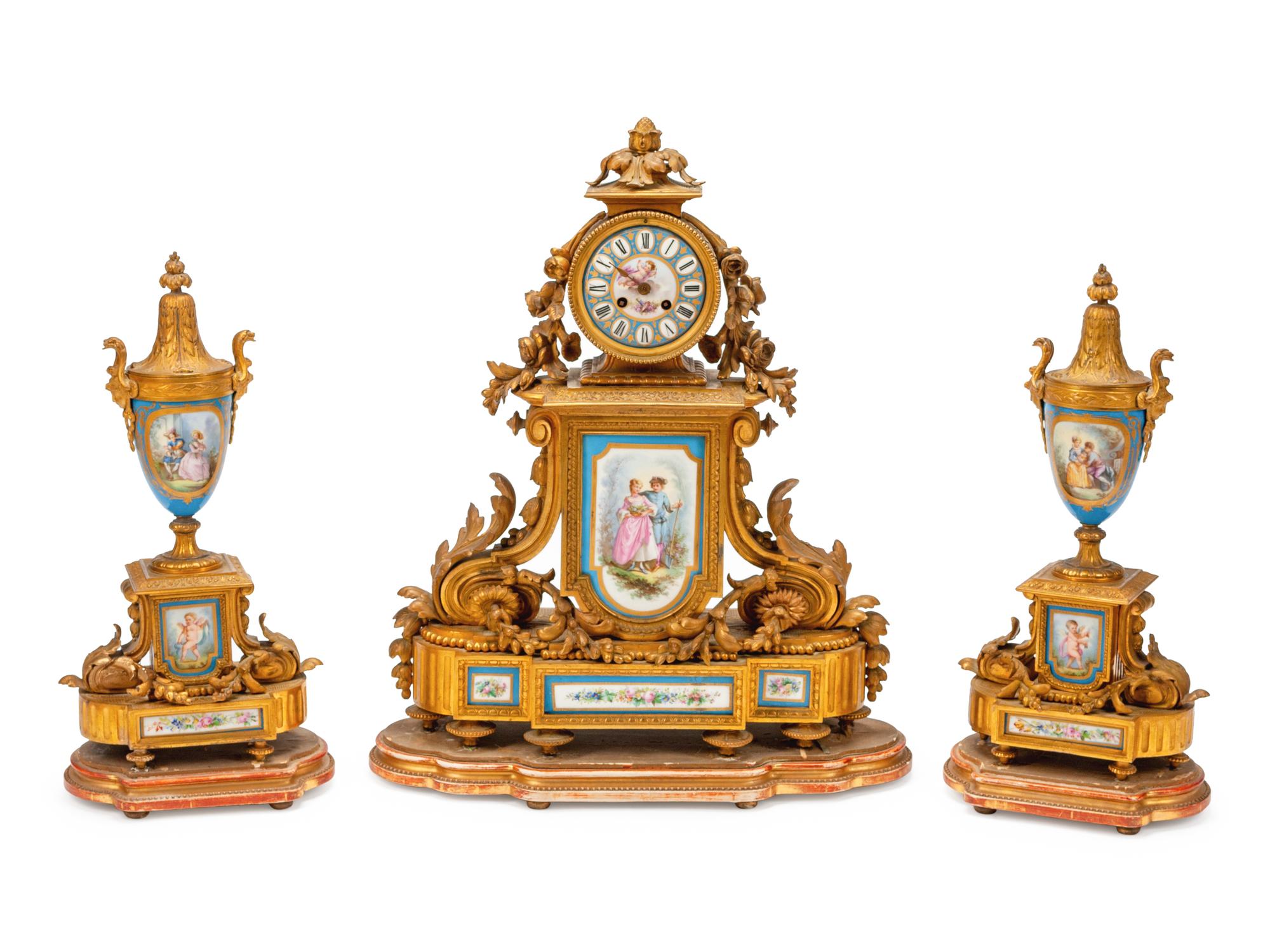 A French Gilt Bronze and Sevres Style Porcelain Clock Garniture