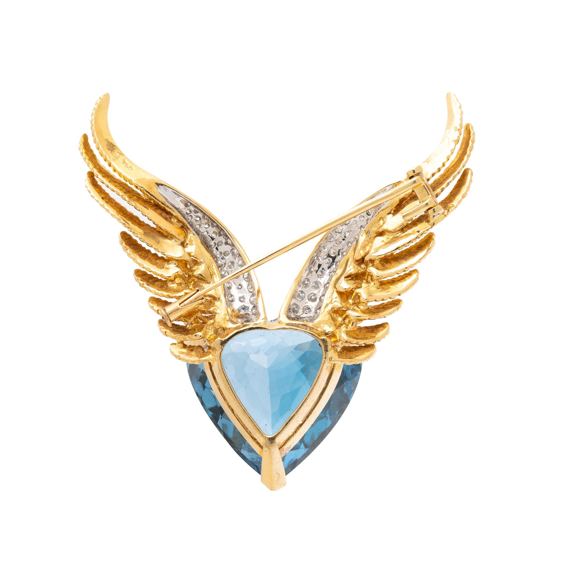 BLUE TOPAZ, DIAMOND, AND YELLOW GOLD WINGED HEART BROOCH