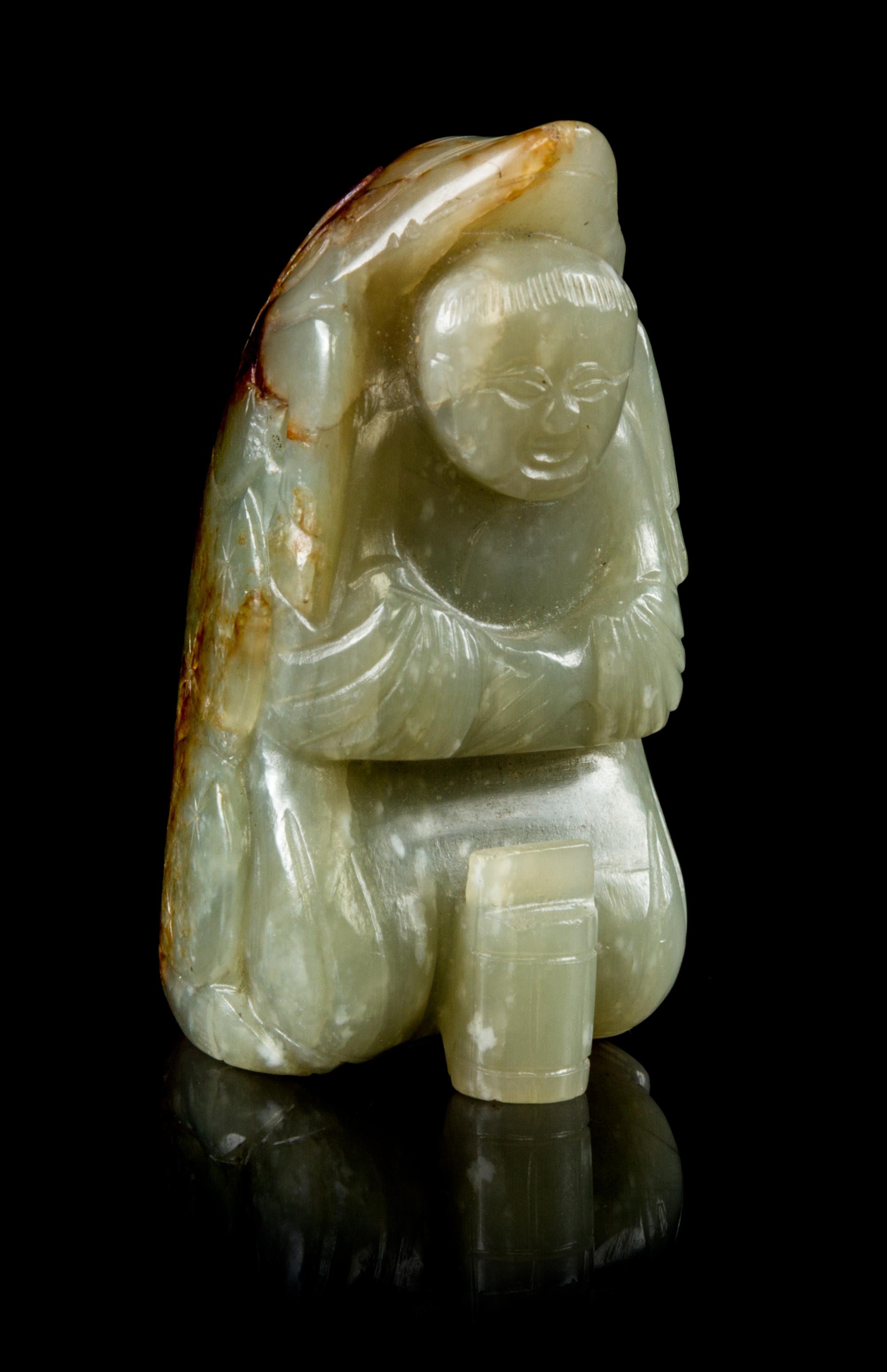 A Carved Jade Figural Toggle Height 2 1/8 inches.
