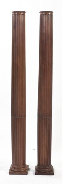 A Pair of American Pine Carved Columns, Height 68 1/8 inches.