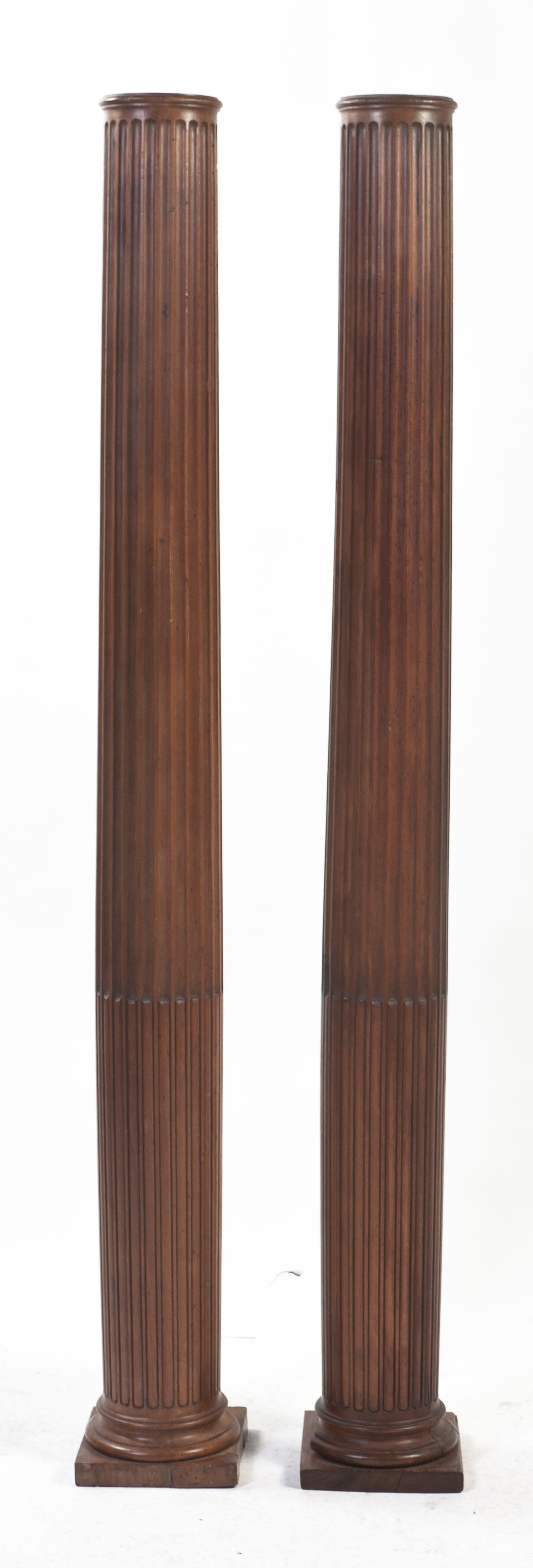 A Pair of American Pine Carved Columns, Height 68 1/8 inches.