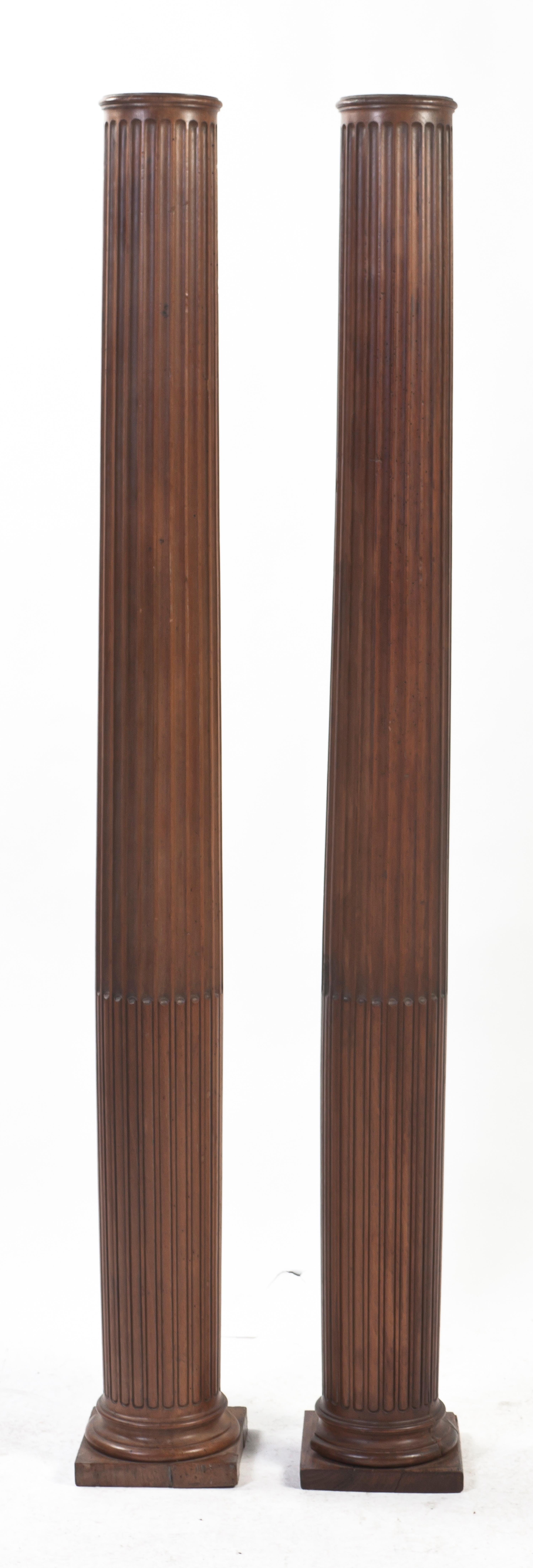 A Pair of American Pine Carved Columns, Height 68 1/8 inches.
