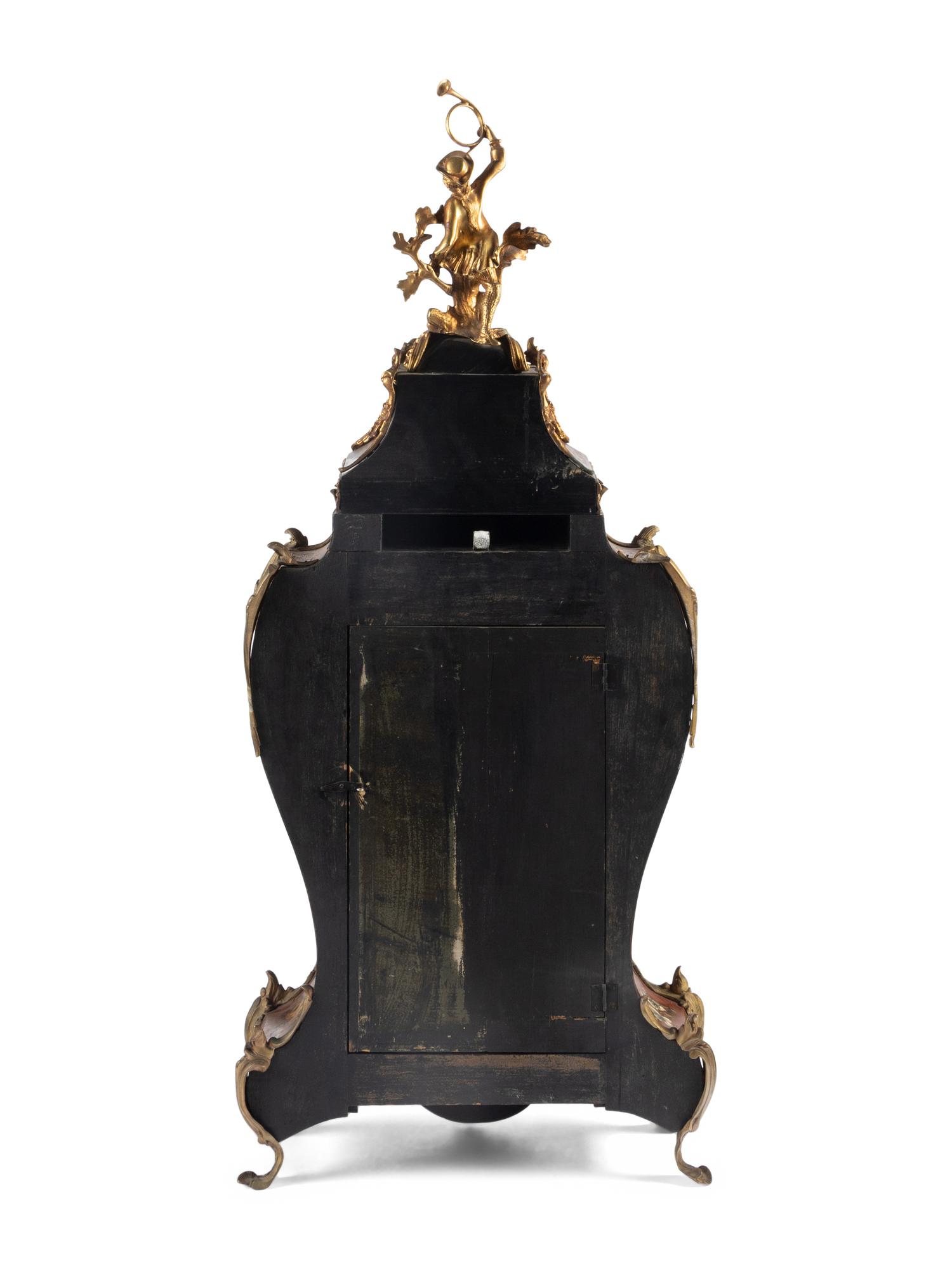 A Louis XV Style Gilt Bronze Mounted Painted Clock and Bracket