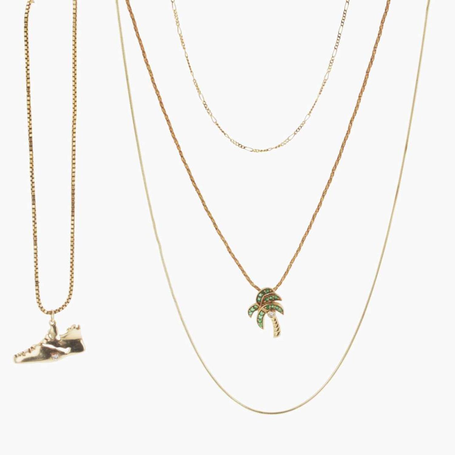 A Collection of Four Yellow Gold Necklaces