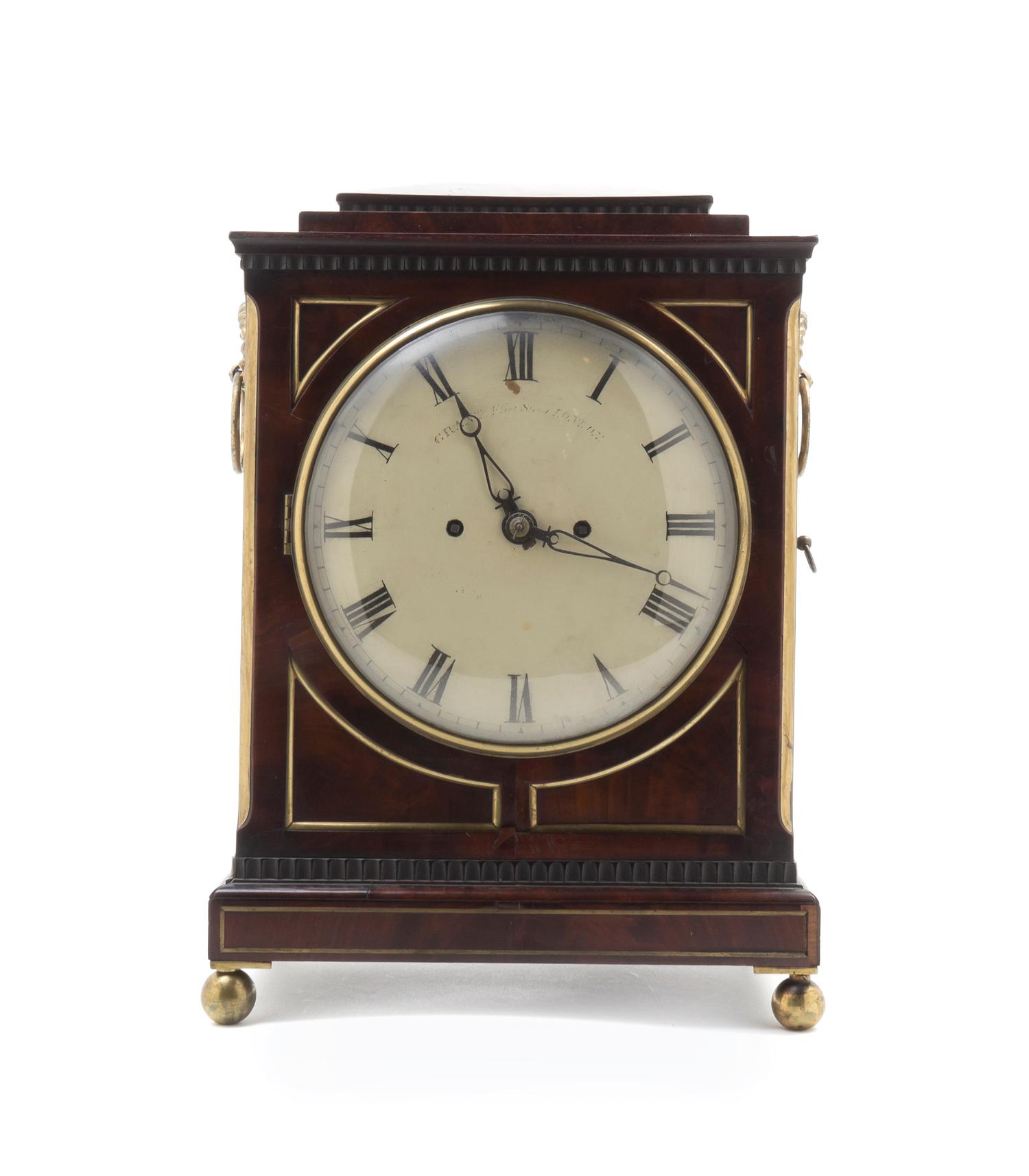 A Regency Brass Mounted Mahogany Bracket Clock, GRANT, LONDON, CIRCA 1910-1915, Height 16 x width 11 1/4 x depth 6 1/2 inches. — GRANT, LONDON, CIRCA 1910-1915,