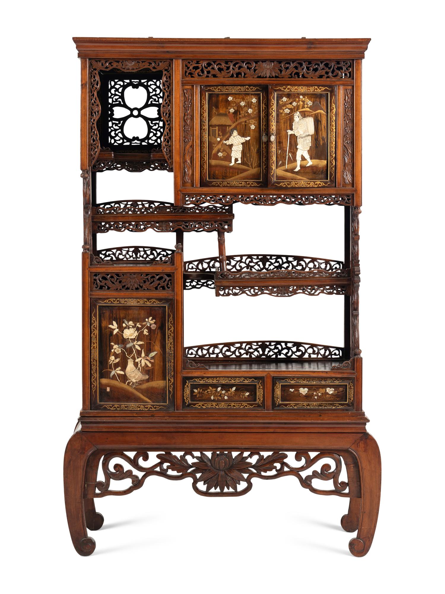 A Victorian Japonesque Carved and Inlaid Cabinet