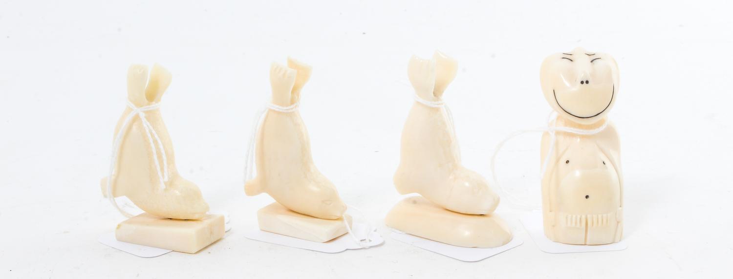 A Collection of Four Walrus Tusk Figures Height 2 1/4 inches. — 20TH CENTURY