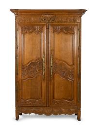 A Louis XV Provincial Style Carved Walnut Armoire