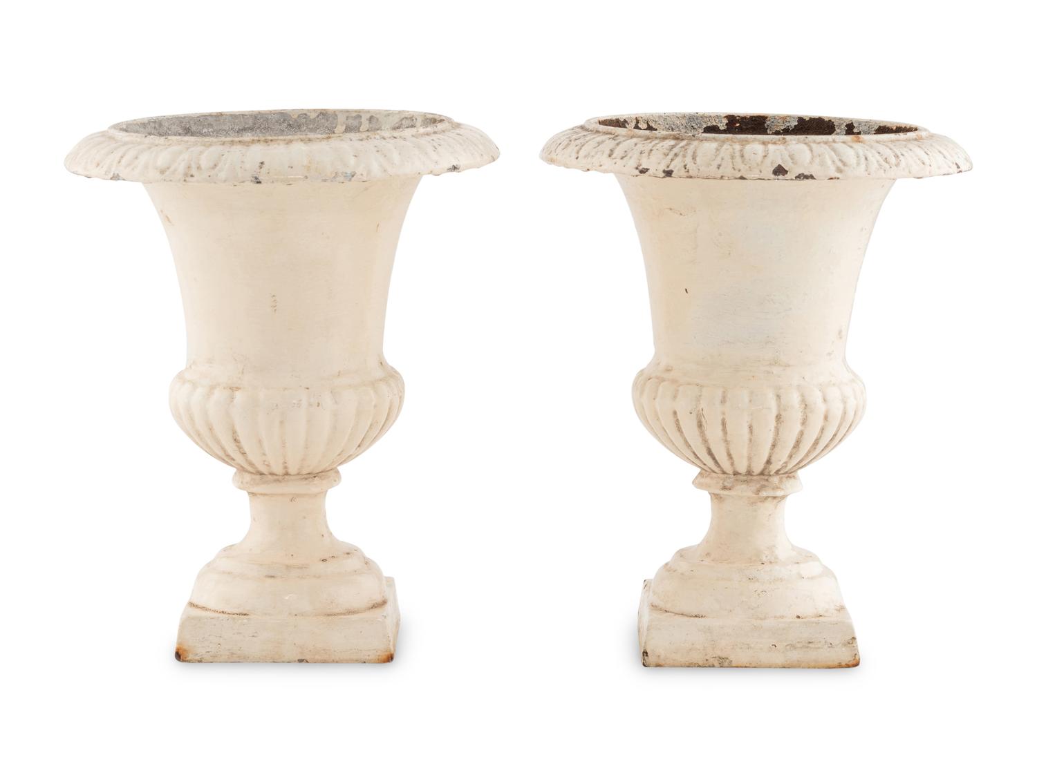 A Pair of Painted Iron Urns