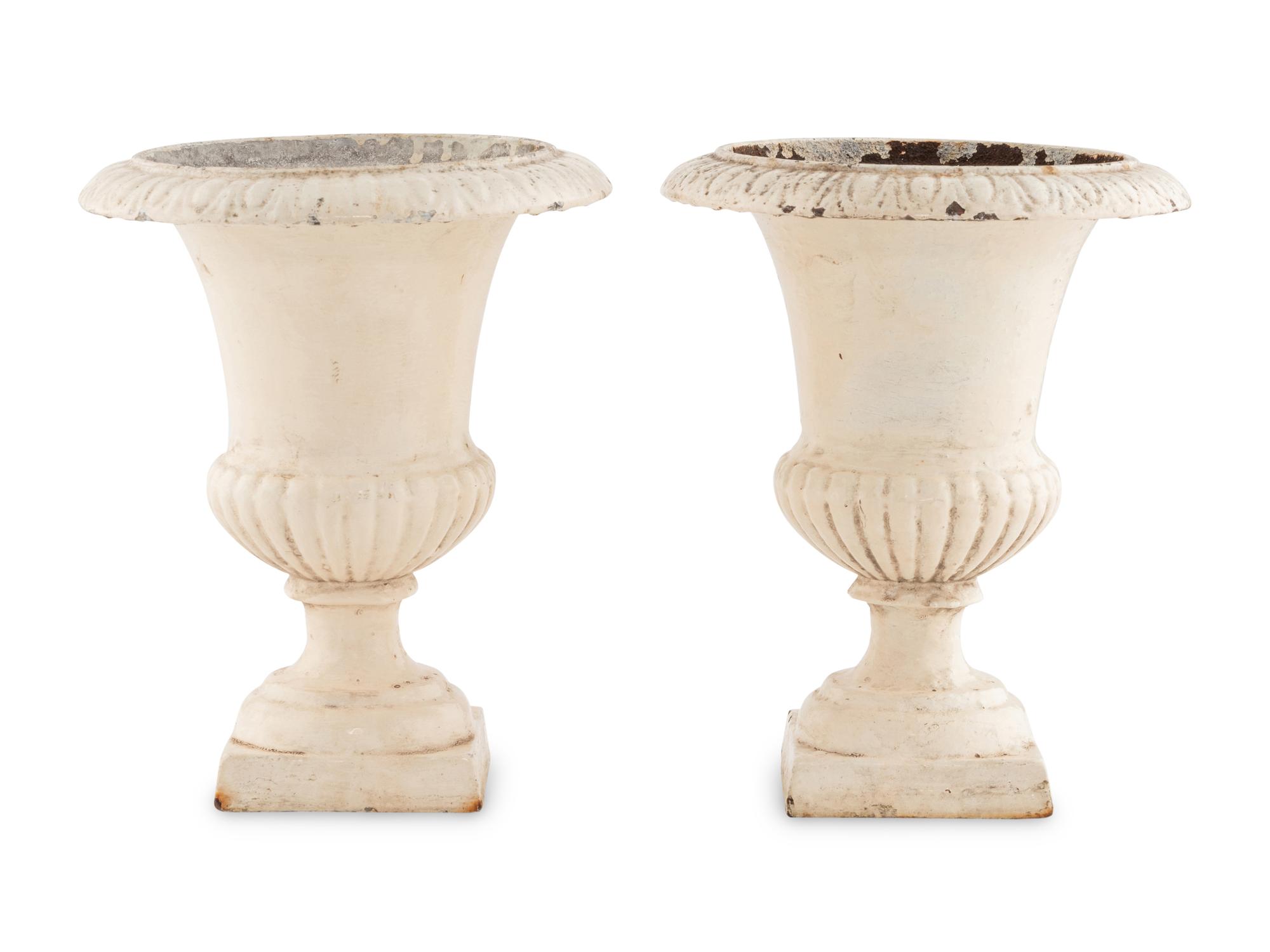 A Pair of Painted Iron Urns