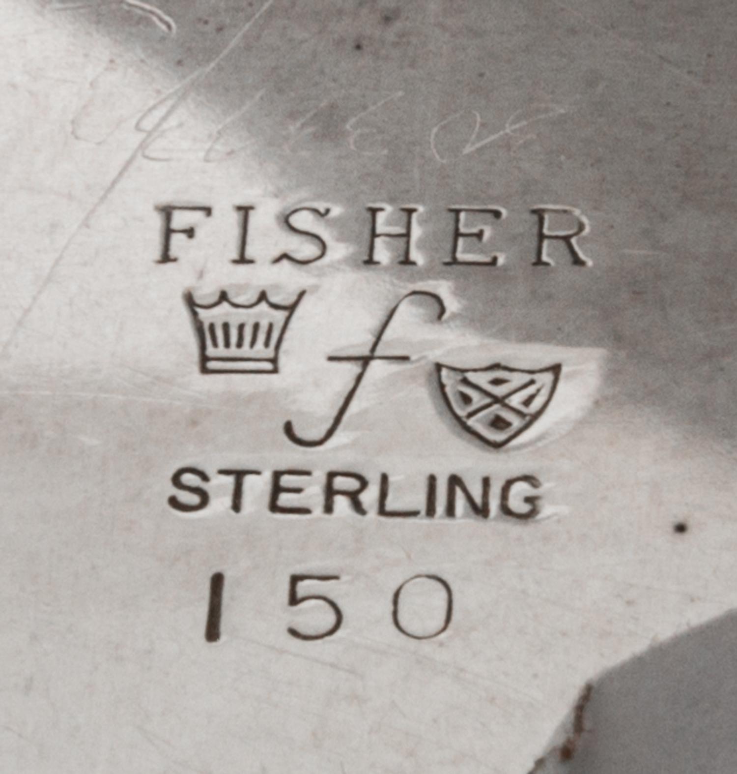An American Silver Dish, Fisher Silversmiths, Newark, NJ, Mid-20th Century, formed as a shell and raised on three scroll supports.
