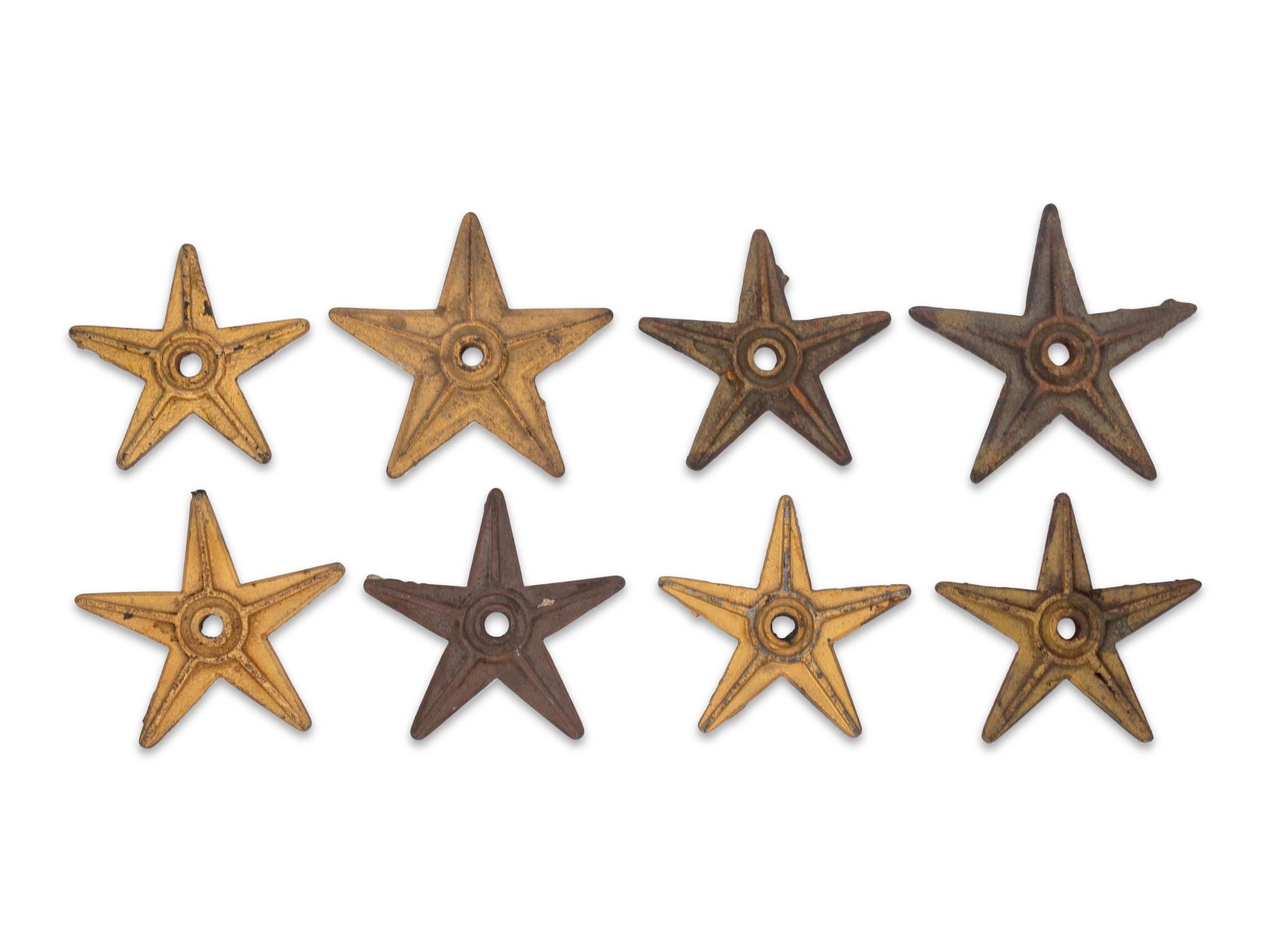 A Group of Eight Cast Metal Stars