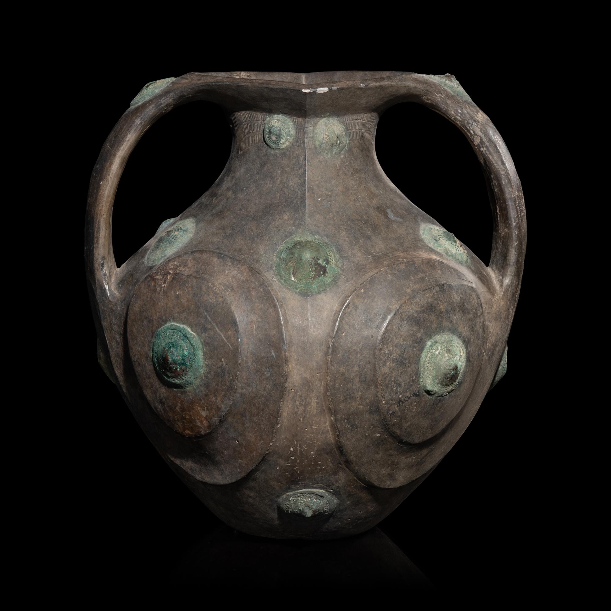 A Chinese Grey Pottery Amphora with Metal Boss Appliques, Western Han Dynasty — 西漢 黑陶嵌铜泡钉双耳壶
