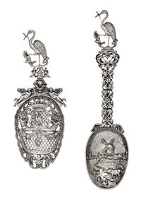 Two Dutch Silver Serving Spoons, Second Half 19th Century, comprsing a pierced example decorated with floral cornucopias and putti figu