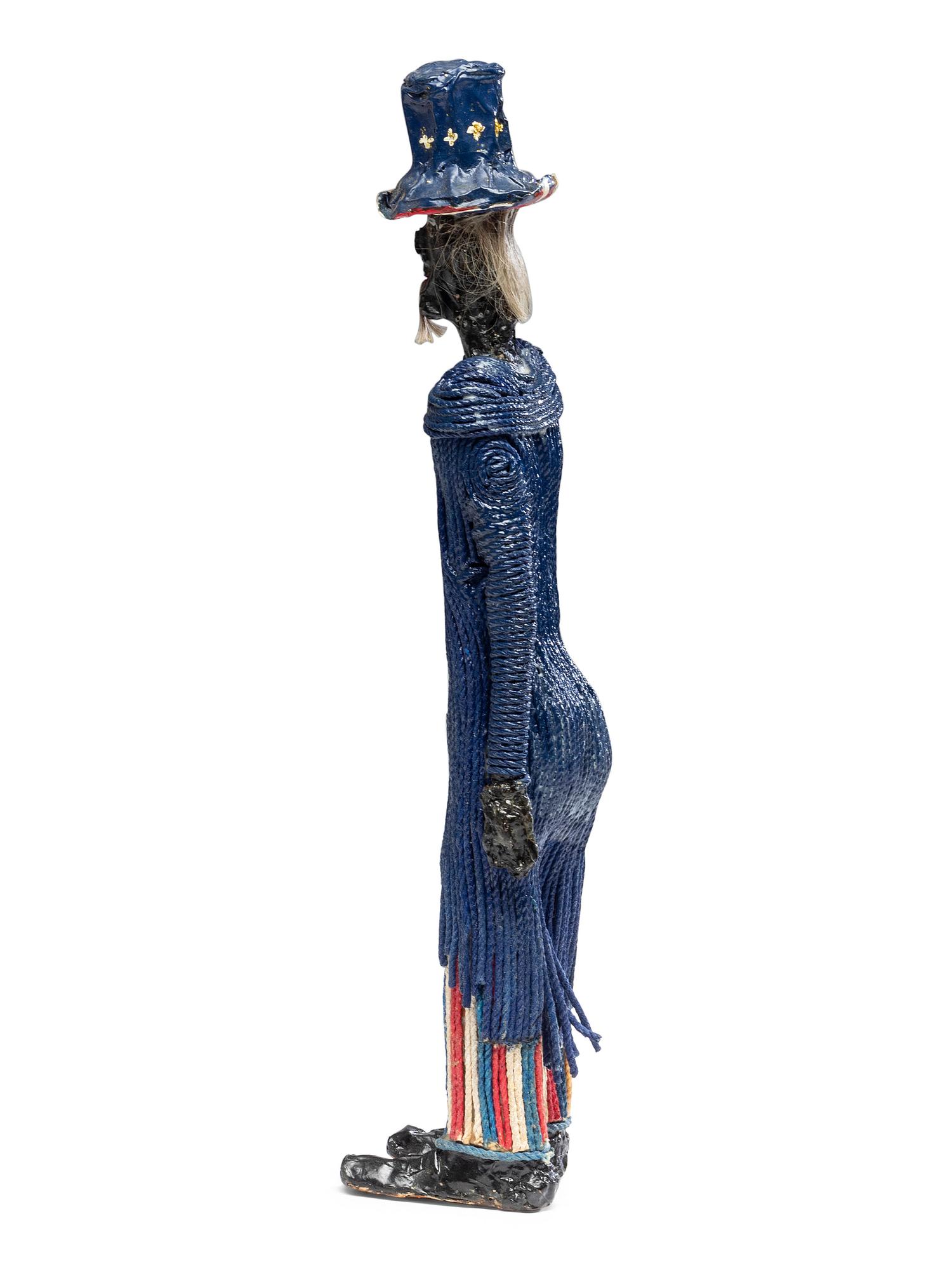 A Folk Art Painted String, Papier Mache and Hair Uncle Sam Figure