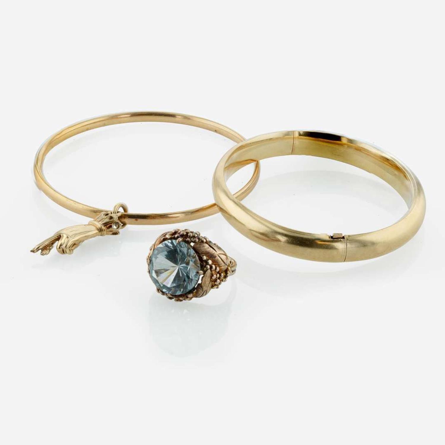 A Collection of Yellow and Rose Gold Bracelets and Ring